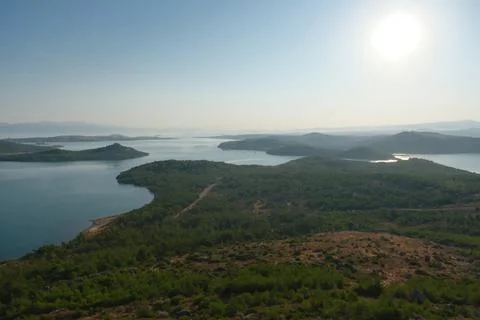 Elevated view of a coastal landscape featuring green islands and blue water Stock Photos