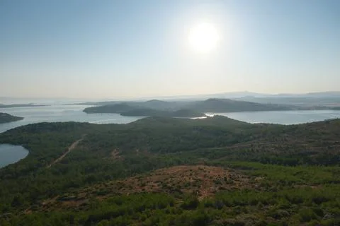 Elevated view of a coastal landscape featuring green islands and blue water Stock Photos