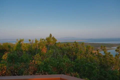 Elevated view of a coastal landscape featuring green islands and blue water Stock Photos
