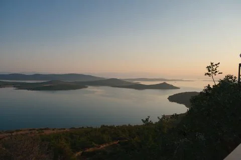 Elevated view of a coastal landscape featuring green islands and blue water Stock Photos