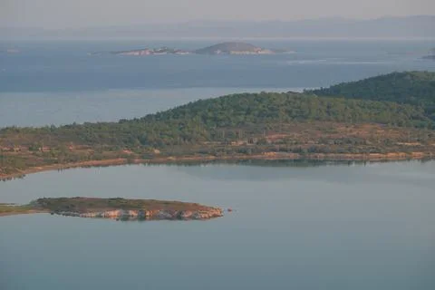 Elevated view of a coastal landscape featuring green islands and blue water Stock Photos