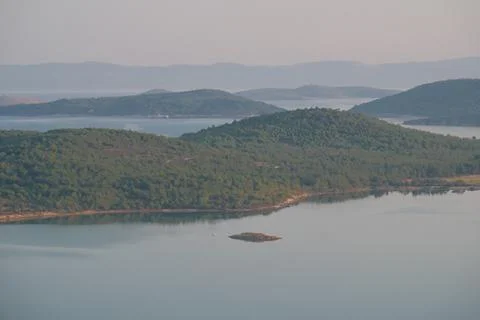 Elevated view of a coastal landscape featuring green islands and blue water Stock Photos