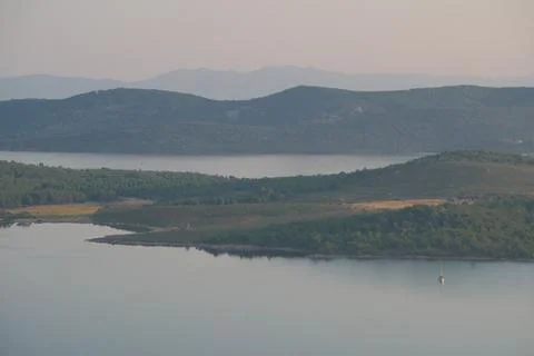 Elevated view of a coastal landscape featuring green islands and blue water Stock Photos