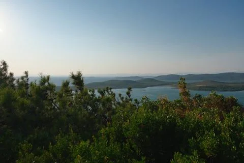 Elevated view of a coastal landscape featuring green islands and blue water Stock Photos