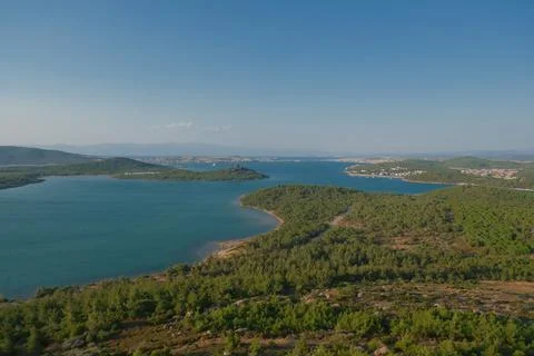 Elevated view of a coastal landscape featuring green islands and blue water Stock Photos