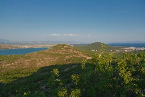 Elevated view of a coastal landscape featuring green islands and blue water Stock Photos