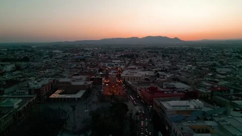 Elevated view of a colonial city at the transition into night Stock Footage 342061676