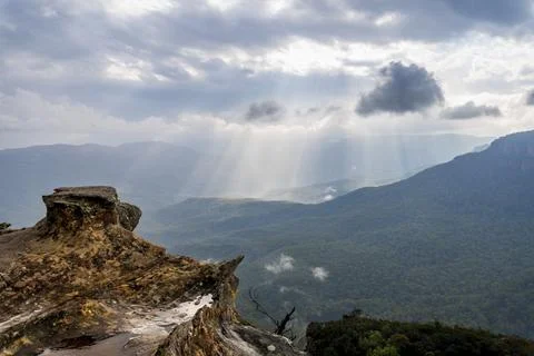 Elevated view of deep rugged valley and rolling hills from a rocky cliff edge Stock Photos