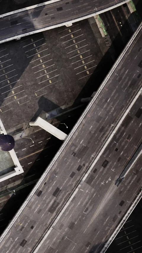 Elevated view of an empty parking lot surrounded by city buildings and roads Stock-Footage 338421408