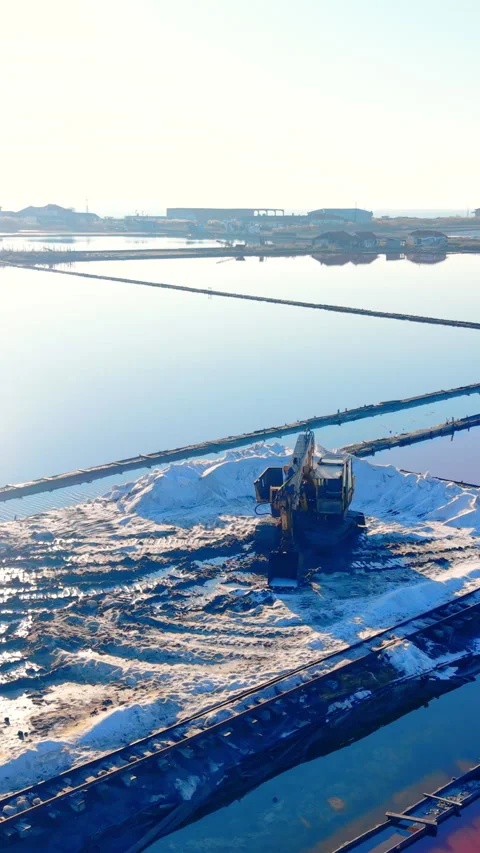 Elevated view of excavator beside evaporation ponds, Pomorie, Bulgaria Vertical Stock Footage 338007311