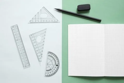 Elevated view geometric equipment notebook pencil eraser dual colorful back.. Stock Photos