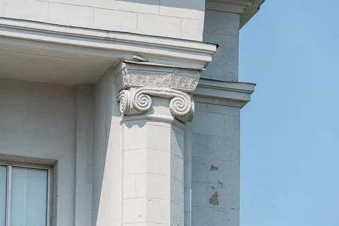 Elevated view of a gray and beige building with classical architectural detai Stock Photos