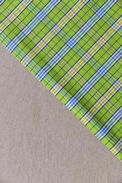 Elevated view green chequered pattern plain textile Stock Photos