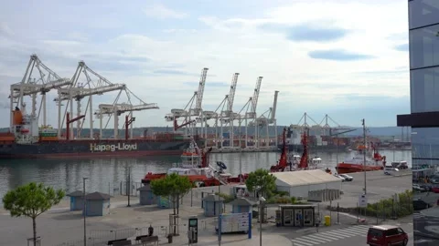Elevated view of Hapag-Lloyd cargo vessel in commercial Port of Koper Stock Footage 156056633