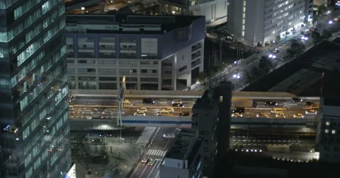 Elevated view of highway traffic in between office buildings. Video stock 61646991