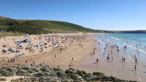 Elevated view of the North Devon beach of Woolacombe with holiday makers Stock Footage 201193877