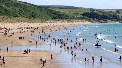 Elevated view of the North Devon beach of Woolacombe with holiday makers Stock Footage 201201932