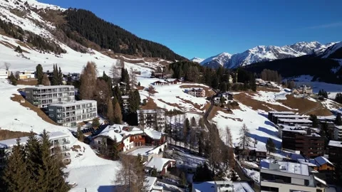 Elevated view over the rooftops and hotels of Davos in the snow Stock Footage 345299477