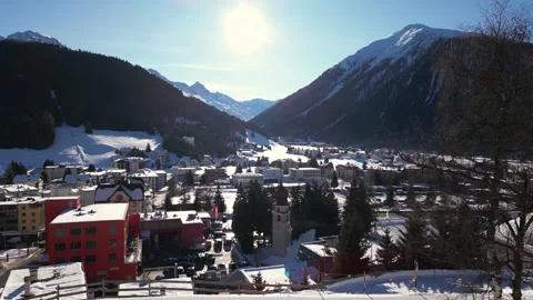 Elevated view over the snow-covered town of Davos in the Swiss Alps Stock Footage 345299299