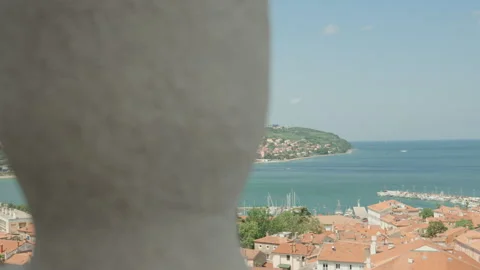 Elevated View of Piran Town and Harbor Framed Through Architecture Stock Footage 341462588