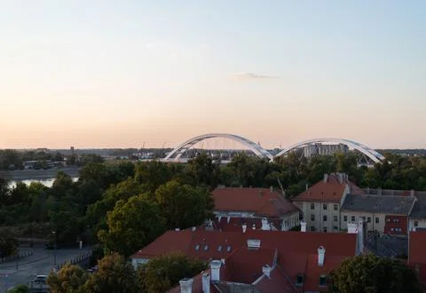 Elevated view of red-tiled roofs and lush green trees in Novi Sad Stock Photos