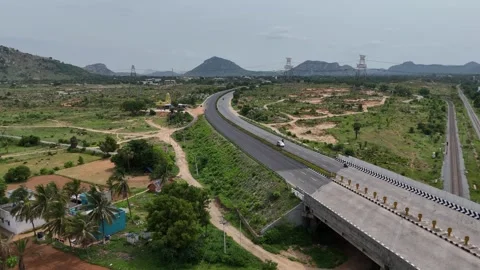 Elevated view of a smooth, wide expressway section of the highway in India Stock Footage 279636881