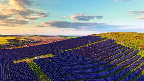 Elevated view of solar farm descending toward village, Bulgaria 스톡 동영상 345152975