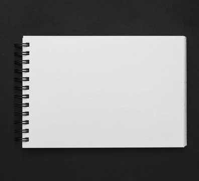 Elevated view spiral notepad black background Stock Photos