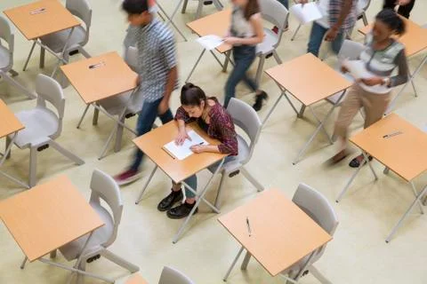 Elevated view of students writing their GCSE exam in classroom Stock Photos