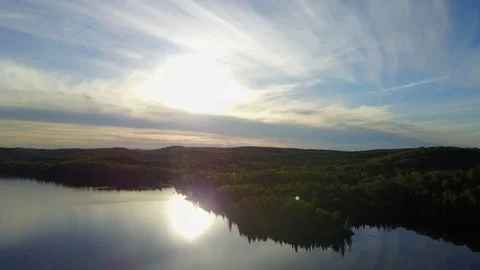 Elevated view of sunlight reflecting in lake of Algonquin park at evening time Stock Footage 109352673