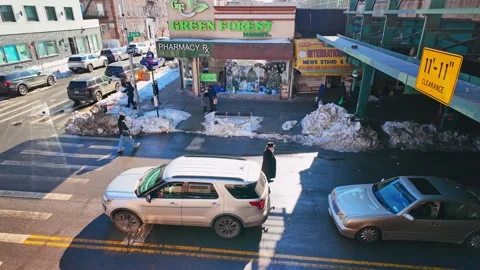 Elevated view of sunny city intersection with melting snow Stock Footage 329315623