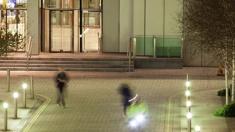 Elevated view time lapse of workers leaving an office after dark Video stock 71396616