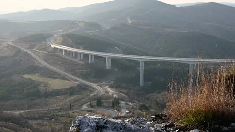 Elevated view of traffic on A1 highway and Crni Kal viaduct Stock Footage 150313761
