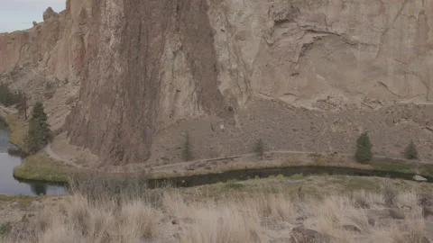 Elevated view of trail along crooked river at Smith Rock State Park Stock Footage 332363716
