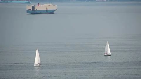 Elevated view of two sailboats passing by on the open sea Stock Footage 158495299
