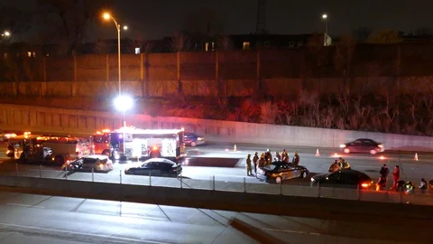 Elevated view of underground highway blocked by traffic accident with fire truck Stock Footage 127541468