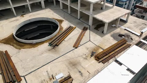 Elevated View: Unveiling the Process of Waterproofing the Commercial Complex Stock Footage 243174353