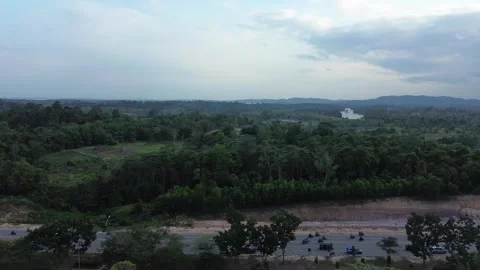 Elevated View of Verdant Landscape with Dynamic Road Traffic and Expansive Sk Stock-Footage 339036970