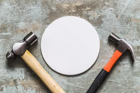 Elevated view white circular frame two hammers Stock Photos