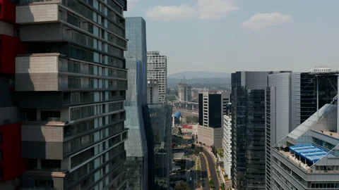 Elevated view of wide street lined by tall buildings. Drone flying high above Stock-Footage 155247500
