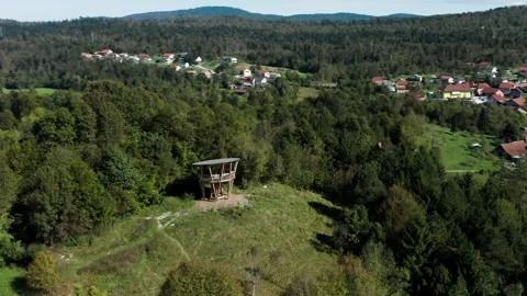 Elevated view of wooden observation deck on hill, overlooking lush green forest. Stock Footage 287114601