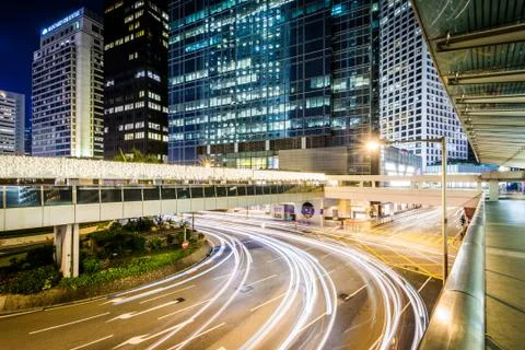 Elevated walkways, view of an intersection and modern skyscrapers at night, a Stock Photos