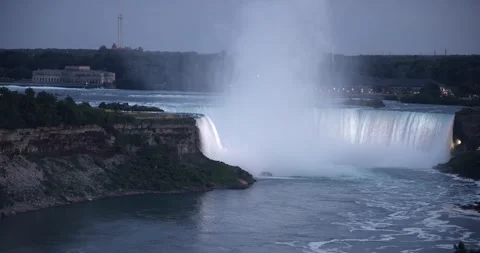 Elevated wide view of bright illuminated Horseshoe falls at dusk Stock Footage 251289916