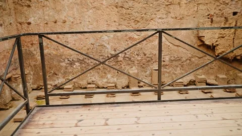 Elevated wooden viewing platform above excavated Pompeii remains, showing Video stock 333655546