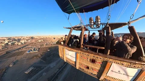 Elevating above the historic terrain of Cappadocia by Balloon. Video stock 265451680