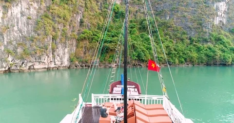 Elevating from boat deck to see Halong Bay via drone Stock Footage 93998074