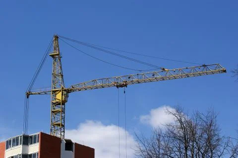 Elevating construction crane Stock Photos