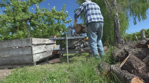 Elevating timelapse of a wood splitting machine Stock Footage 43345107