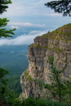 The Elevation Elixir: Green Mountain Ranges Under Blue Canopies Stock Photos