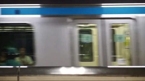 Elevation shot of fast train running to depart at station Stock Footage 71223195